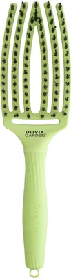 A light green hair brush with black bristles is shown against a white background.