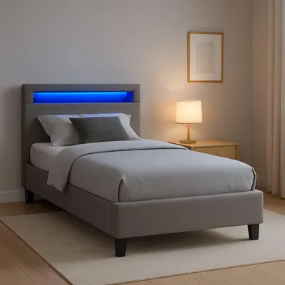 A bedroom scene with a bed, nightstand, and lamp.