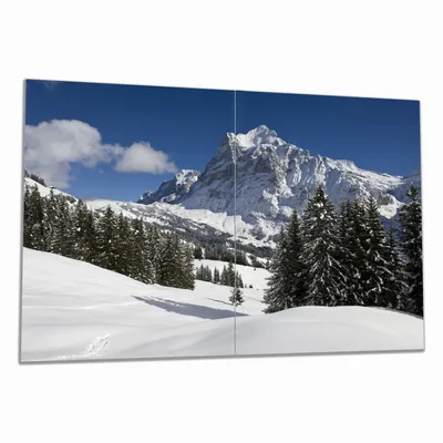 Produktbild von Wallario Herdabdeckplatte aus Glas, Größe 80 x 52 cm 2-teilig, Motiv Verschneiter Berghang unter blauem Himmel