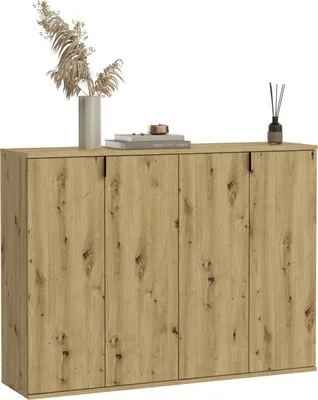 A wooden cabinet with decorative items on top.