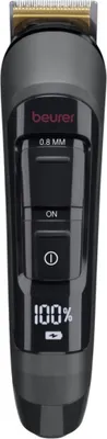 A close-up studio shot of a black electric trimmer against a white background.