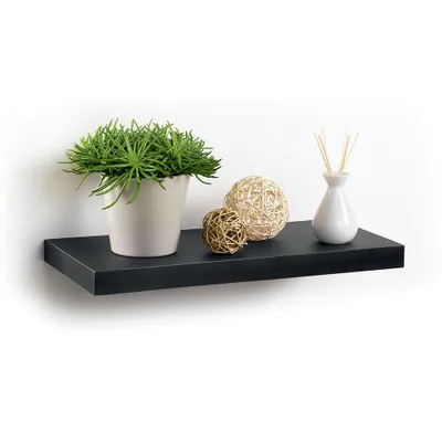A black floating shelf with decorative items on it.