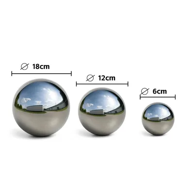 Three polished stainless steel garden spheres of different sizes are displayed on a white background with size indicators.