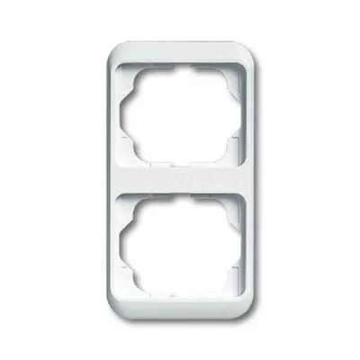 A white electrical outlet frame with two openings.
