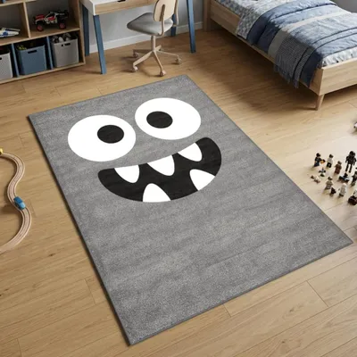 Zdjęcie produktu dla Dywanik do zabawy w kolorze szarym z motywem twarzy potwora – wymiary: 140 x 200 cm