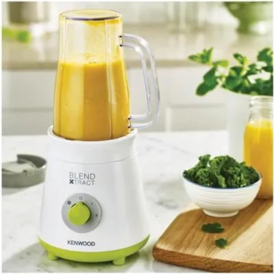 A Kenwood Blend Xtract smoothie maker is shown on a kitchen counter with ingredients for a smoothie.