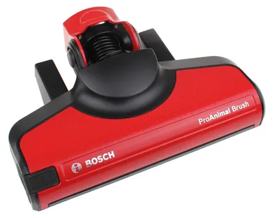 A red and black vacuum cleaner floor head is shown against a white background.