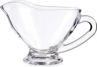 A clear glass gravy boat with a handle and a footed base, isolated on a white background.