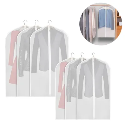 A collection of garment bags for clothes, some containing outfits.
