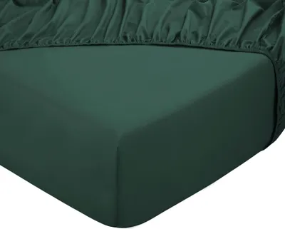 A close-up view of a dark green fitted sheet, showing the texture and elastic edge.