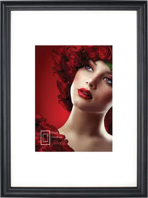 A framed picture of a woman with roses in her hair.