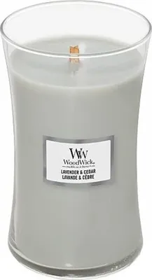 A WoodWick Lavender & Cedar scented candle in a clear glass jar.