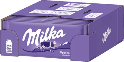 A cardboard box filled with Milka Alpine Milk chocolate bars.