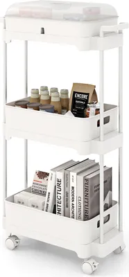 A white three-tier rolling cart filled with various items, including bottles, jars, a bag of coffee, and books.