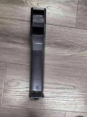 A black and gray water tank assembly for a Laresar M3 vacuum cleaner is shown on a wooden floor.