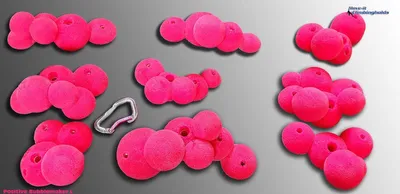 Produktfoto der "Positive Bubblemaker L Klettergriffe" von Move-it-Climbingholds; pinke Klettergriffe in verschiedenen Formen; mit einem Karabiner.