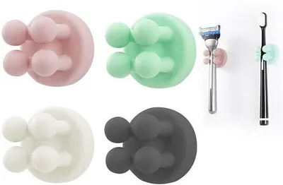 Imagen del producto de Juego de 4 soportes de silicona autoadhesivos para cepillos de dientes y maquinillas de afeitar