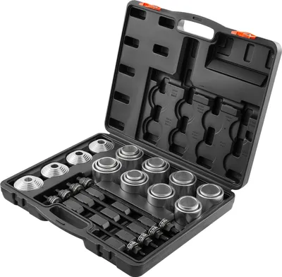 A black plastic carrying case containing a set of metal bearing puller and installer tools.