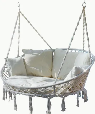 A white double hanging chair with cushions, suspended by ropes.