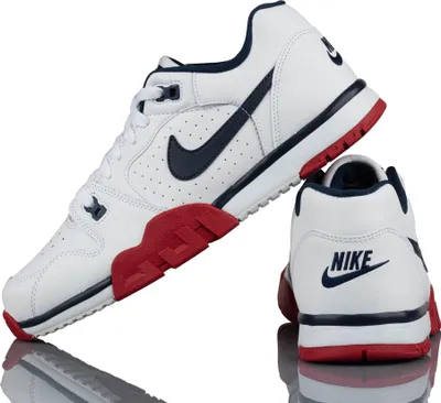 A pair of Nike Cross Trainer Low sports shoes are displayed against a white background.