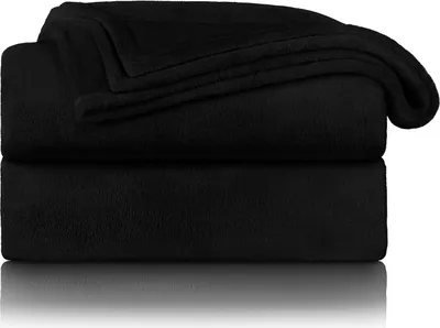 Two black fleece blankets are stacked on top of each other.