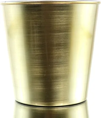 A close-up studio shot of a gold-colored conical pot.