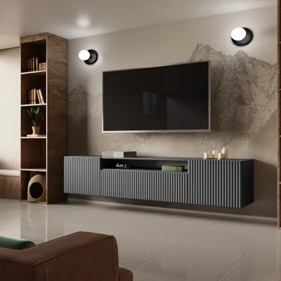 A modern living room with a wall-mounted TV and entertainment unit.