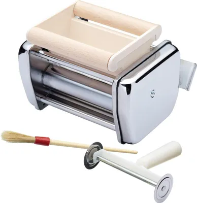 A pasta maker attachment and accessories are displayed against a white background.