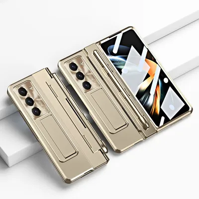A gold-colored phone case with a stand and pen holder is displayed on a white surface.