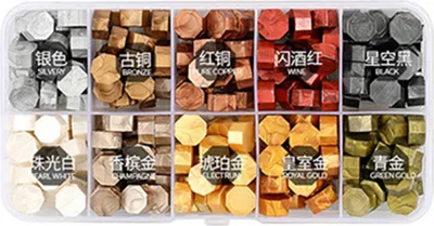 A box containing multiple compartments, each filled with colorful wax beads for sealing.