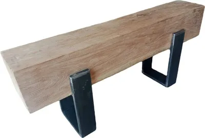 A wooden beam resting on two black metal supports.