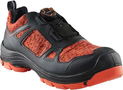 A single black and orange safety shoe is shown against a white background.