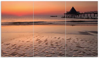 Produktbild von Wallario Herdabdeckplatte aus Glas, Größe 90 x 52 cm 3-teilig, Motiv Strand am Abend - Seebrücke am Ostseebad Heringsdorf