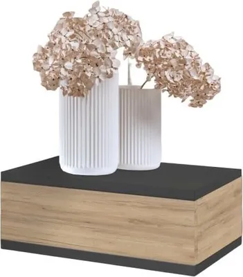 Two white vases with dried flowers on top of a floating nightstand.