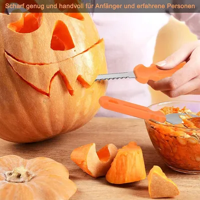 A person is carving a pumpkin with a set of carving tools. The tools and carved pumpkin pieces are laid out on a wooden surface.