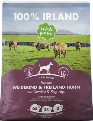 A bag of dog food with a pastoral scene of cows in a field on the front.