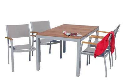 A dining set with a table and four chairs, set against a white background.