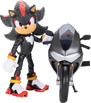A toy action figure of Shadow the Hedgehog standing next to a toy motorcycle.