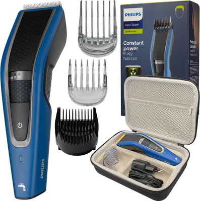A Philips hair clipper set is displayed with its accessories and packaging.