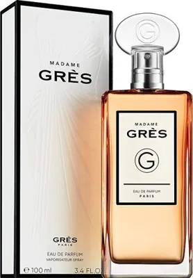 A perfume bottle and its box are displayed against a white background.