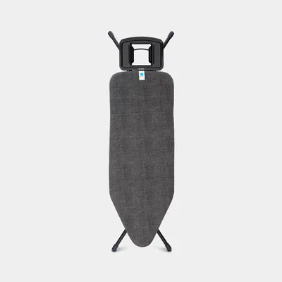 An ironing board standing upright against a plain background.