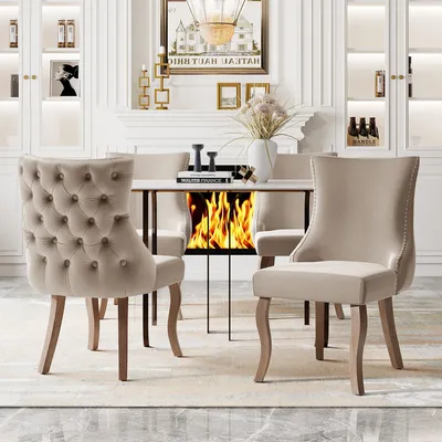 A dining room scene with chairs around a table.