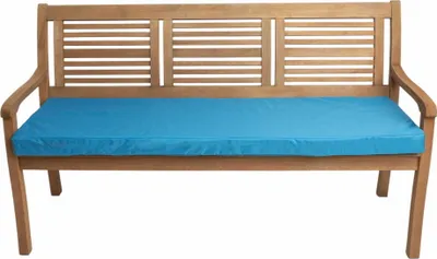 A wooden bench with a blue cushion.