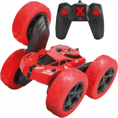 A red remote-controlled stunt car and its black remote control are shown against a white background.