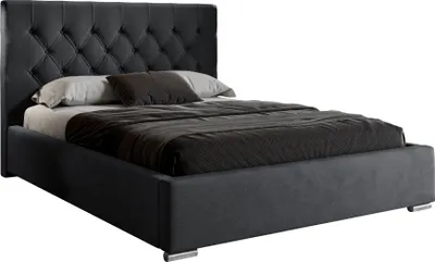 A dark gray upholstered bed with a tufted headboard and a mattress with dark gray bedding.