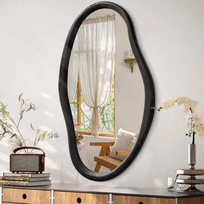Immagine prodotto di Specchio da parete asimmetrico, con cornice in legno nera, dimensioni 75 x 45 cm, dal design decorativo