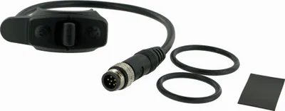 A black e-bike shift control unit with a cable and connector, along with two rubber rings and a small black pad, is laid out on a white background.