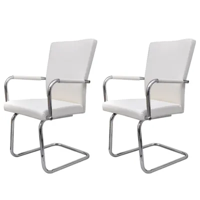 Two white faux leather cantilever chairs with chrome frames are shown against a white background.