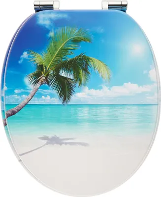 A toilet seat with a tropical beach scene printed on it.