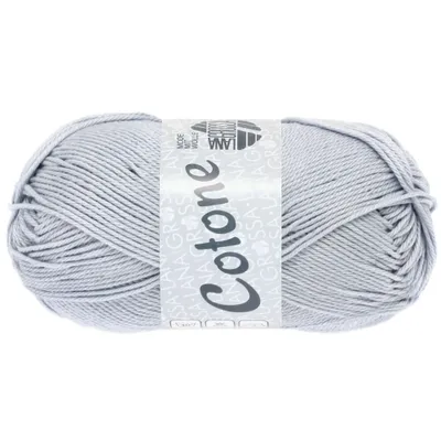 A ball of light gray yarn with a label wrapped around it.